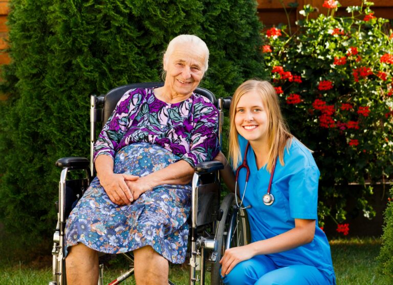 Kind doctor taking care of elderly woman at the nursing home.